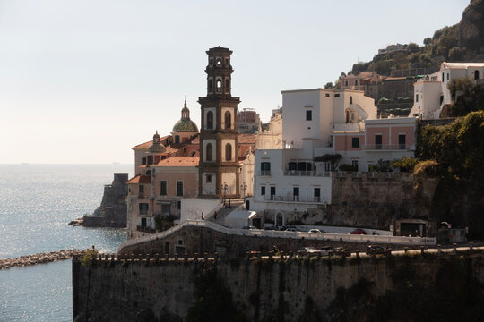 Scenic view of Atrani village on the Amalfi Coast framed through a window in natural light."