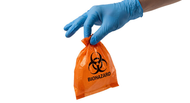 Gloved hand holding orange biohazard bag with the universal biohazard symbol, representing infectious waste disposal and laboratory safety protocols