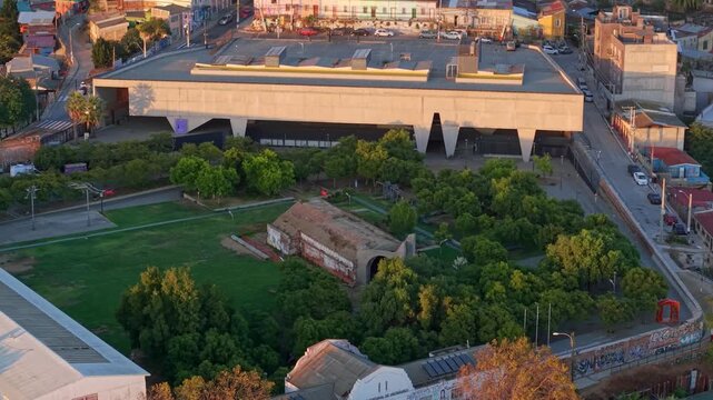 Aerial establishing fly above Valparaiso Cultural Park Chile, Urban green square, previous penitentiary building