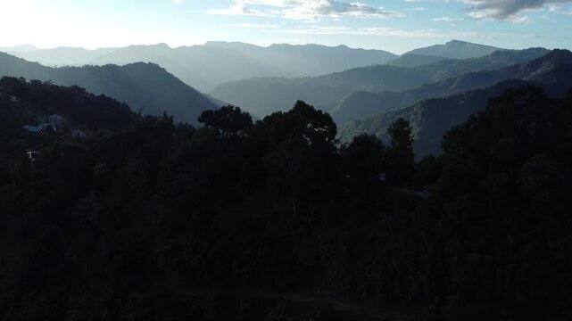 The light of the sunset has created parallel lines on the hills.