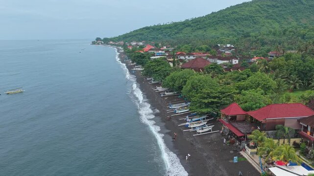 Aerial view of amed black sand beach in bali