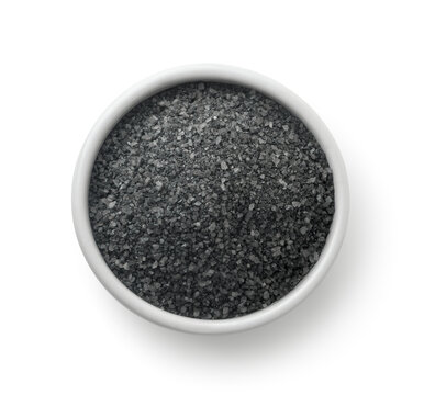 Top view of black salt in ceramic cup