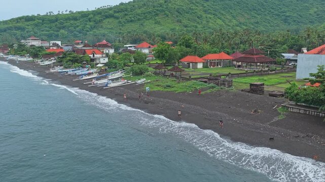 Aerial view of amed black sand beach in bali