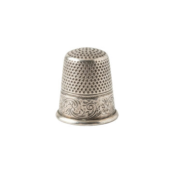 Antique metal thimble with etched floral pattern