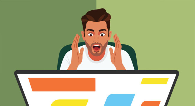 A man stares at a computer screen with a shocked and surprised expression on face