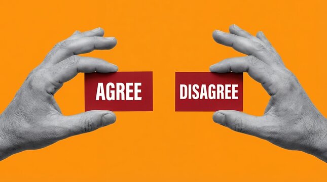 Two hands hold red cards with the words AGREE and DISAGREE in white text set against an orange background choice decision opinion difference opposition agreement contrast