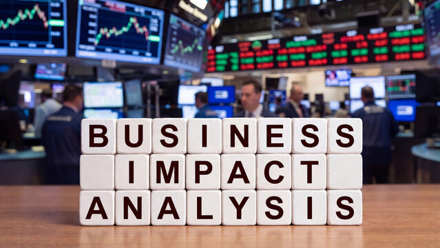 Business impact analysis letter blocks on financial trading floor for enterprise risk evaluation market disruption assessment corporate decision making and operational continuity planning
