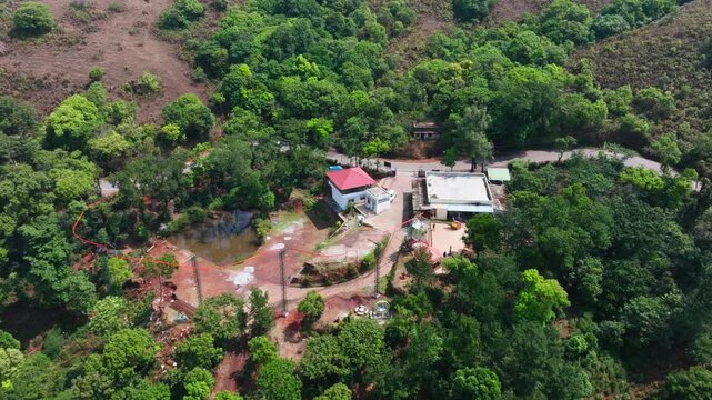 Mubarak Adventure Park with trees and road at Attigundi, Inam Dattathreya Peeta, Karnataka, india. day time, top down shot, jib shot, drone shot, 4k.