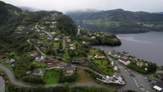 Haus village on Osteroy near Bergen in Vestland Norway with church roads and fjord landscape