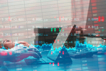 Obraz na płótnie Canvas Close up of hands using a keyboard with digital stock exchange numbers and financial charts overlay. Concept for high frequency trading, artificial intelligence in finance and big data analysis.