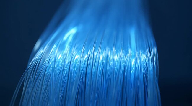 Abstract Blue Optical Fibers Against a Dark Blue Background with Bright Center Light and Bottom Fiber Ends