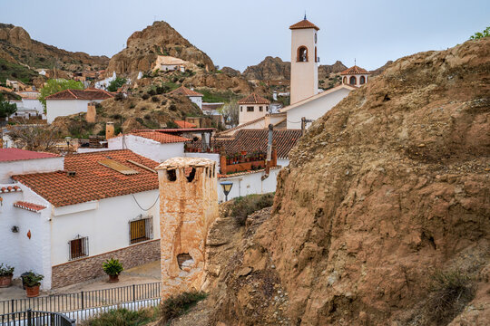 Cave houses village in Guadix with bell tower, Andalusia, Spain