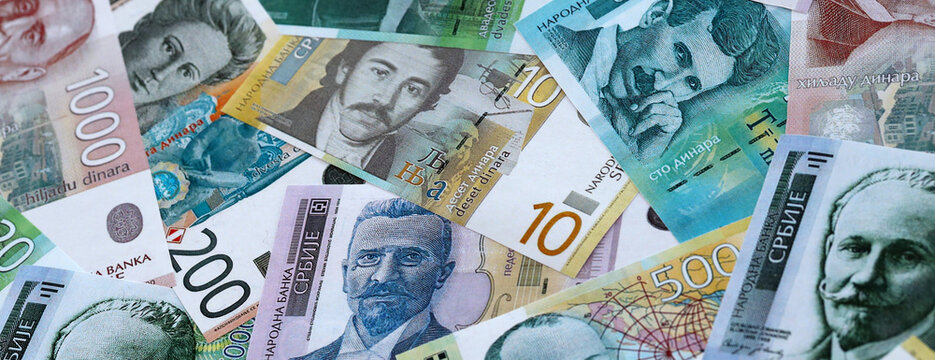 Serbian dinar money banknotes pile on table. Serbia bills of RSD currency. Concept of economy