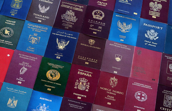 Big amount of passport covers from many biometrical passports close up. Travel concept