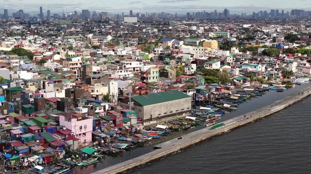Aerial view of manila slums contrasting with modern skyscrapers