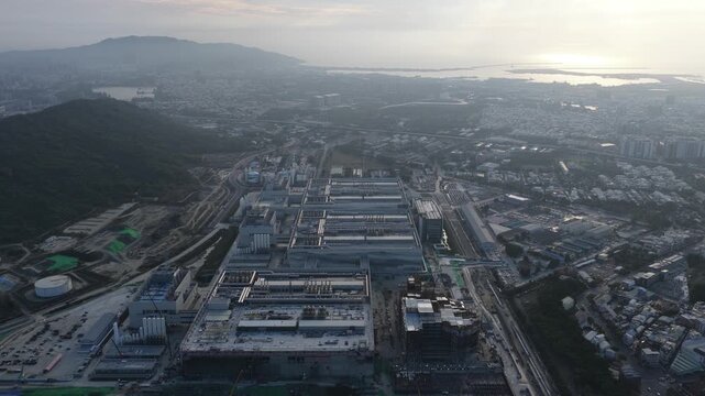 Aerial view of a large semiconductor factory under construction