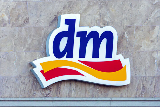 International beauty store DM logo outside on facade wall urban building in Serbian capital Belgrade