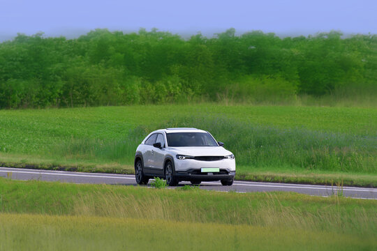 Zero emission electric SUV traveling outdoors