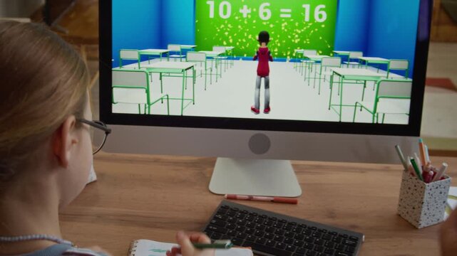 Handheld back view of father sitting next to daughter in front of computer screen, solving arithmetic task in educational game while learning together at home