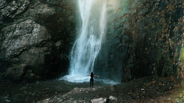 Girl infront of big Gveleti waterfall in Georgia