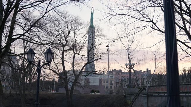 Slow Motion Freedom Monument at Sunrise in Riga, Cinematic Milda Statue and Gilded Stars in Latvia