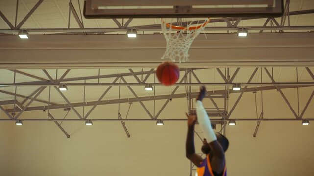 Basketball players in an indoor stadium