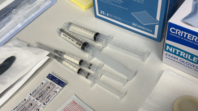 Hypodermic needles filled with antibiotics at a doctor's office.