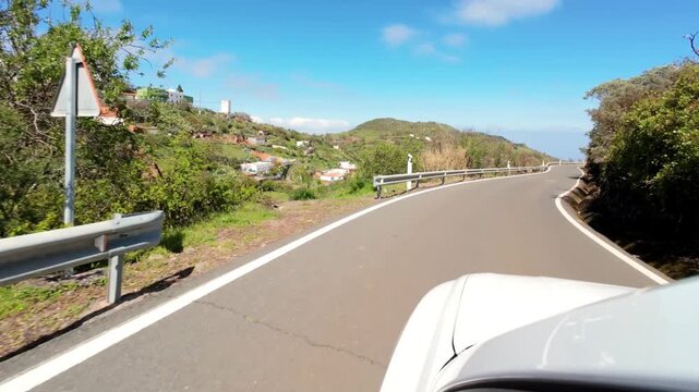 Point of view driving on a scenic mountain road with expansive landscape views in Gran Canaria
