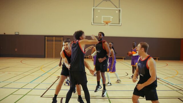 Basketball players celebrate victory