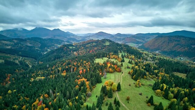 Drone hyperlapse with 180 degree flip over autumn wilderness