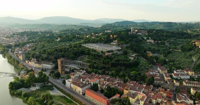 Aerial drone view Florence Italy historic district park near Piazzale Michelangelo summer travel destination Tuscany urban landscape scenic riverfront architecture.