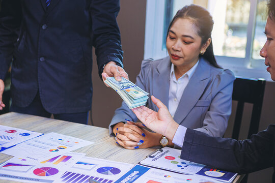Businessman paid money banknotes and making decision for business investment. Selected focus