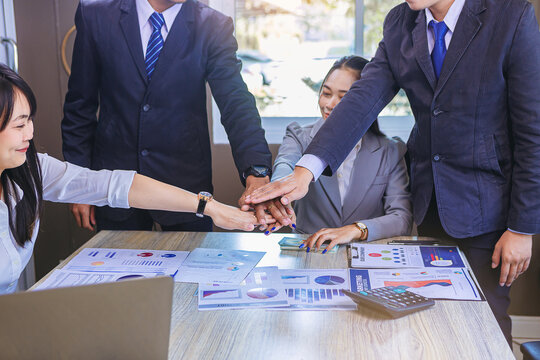 Group of business peoples meeting and join hands in office. Team work for success concept. Selected focus