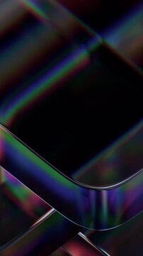 Abstract iridescent glass shapes on a black background, vertical 4k seamless loop 3d animation
