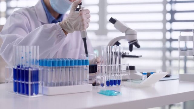 Asian adult scientist research lab microscope experiment medical discovery analysis biotechnology focused innovation healthcare development scientific advancement