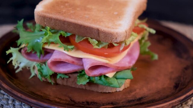 Looping sandwich rotation with fresh ingredients, close up