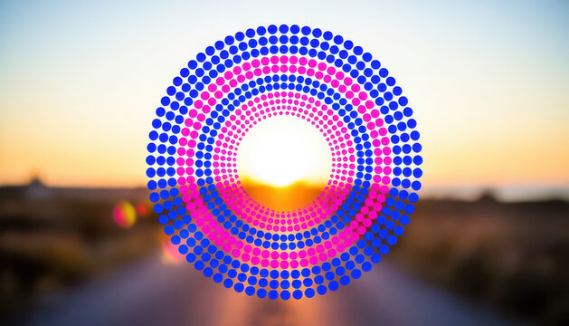 A vibrant sunset is visible beyond a road, with colorful circles overlaying the scene. The circles in various shades enhance the visual depth of the sunset.