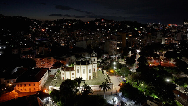 Gloria Church At Night In Rio De Janeiro In Brazil. Illuminated Church Landscape. Downtown District. Highrise Buildings. Gloria Church At Night In Rio De Janeiro In Brazil. 