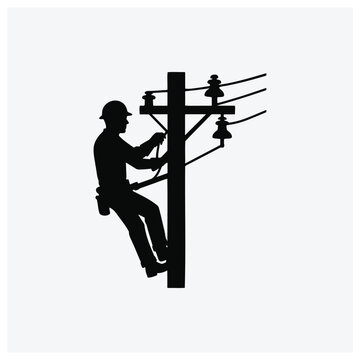 Silhouette of an electrician working on power lines from a utility pole.
