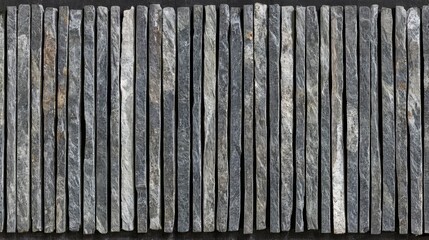 Fototapeta premium Slate stone tiles texture grey layered wall pattern natural rough surface horizontal rows vertical lines rock background construction material rustic design detail