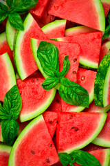 Triangles of sliced watermelon close-up. Watermelon pattern, macro photo. Close-up. © Yaruniv-Studio