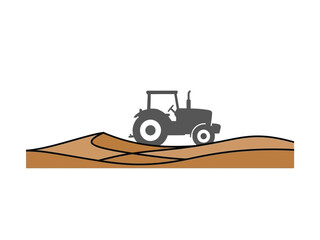 Naklejka premium Silhouette of a tractor working on a farm field.