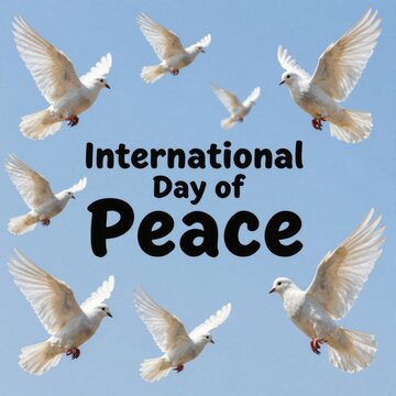International Day of Peace, white doves flying in blue sky
