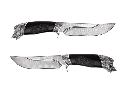 Ornate hunting knives with Damascus steel blades and carved boar head handles on white back