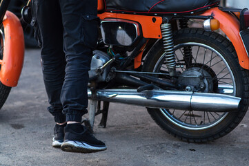 Fototapeta premium old orange retro motorcycle with a two-cylinder internal combustion engine