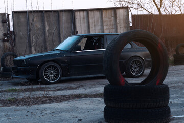 drift powerful car in an old body with black extension and bottom lighting night photography with long exposure © yurii oliinyk