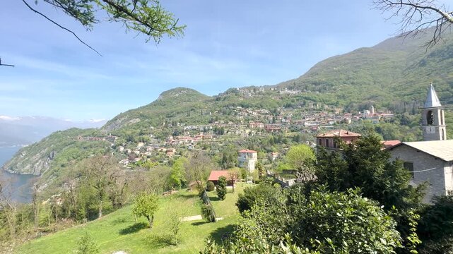 Scenic Lakeside Villages of Lake Como Surrounded by Green Mountains, Italy Travel Destination Landscape Viewed from the Water