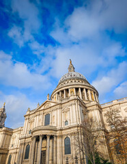 Fototapeta premium St Pauls Cathedral in London on a sunny day, iconic historic landmark with blue sky, famous British architecture and travel destination scene