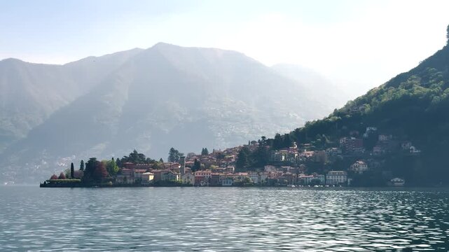 Scenic Lakeside Villages of Lake Como Surrounded by Green Mountains, Italy Travel Destination Landscape Viewed from the Water