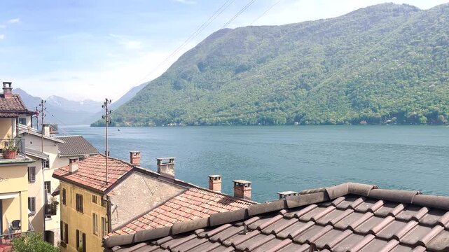 Houses in Gandria against Lugano lake. View from sentiero di Gandria Lugano, Scenic Olive Trail by Lake, Travel Lifestyle Nature Experience in Switzerland